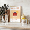 Abstract illustration of a bramble cocktail with orange and blue splashes - styled on a counter with eucalyptus and a bowl of lemons