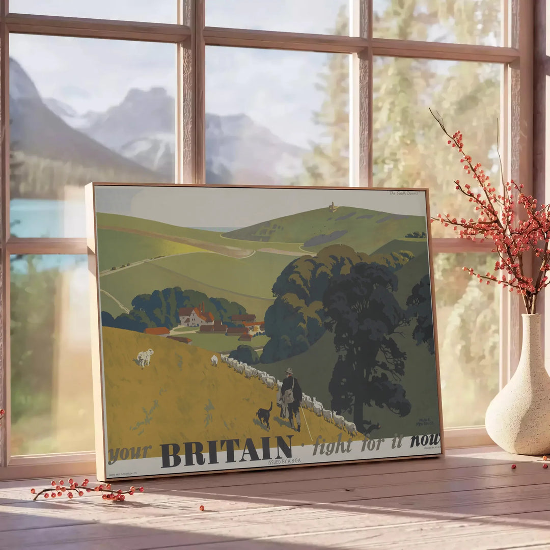 A vintage-style travel poster featuring iconic British landmarks in muted gray and green tones - beside a round wooden side table with books