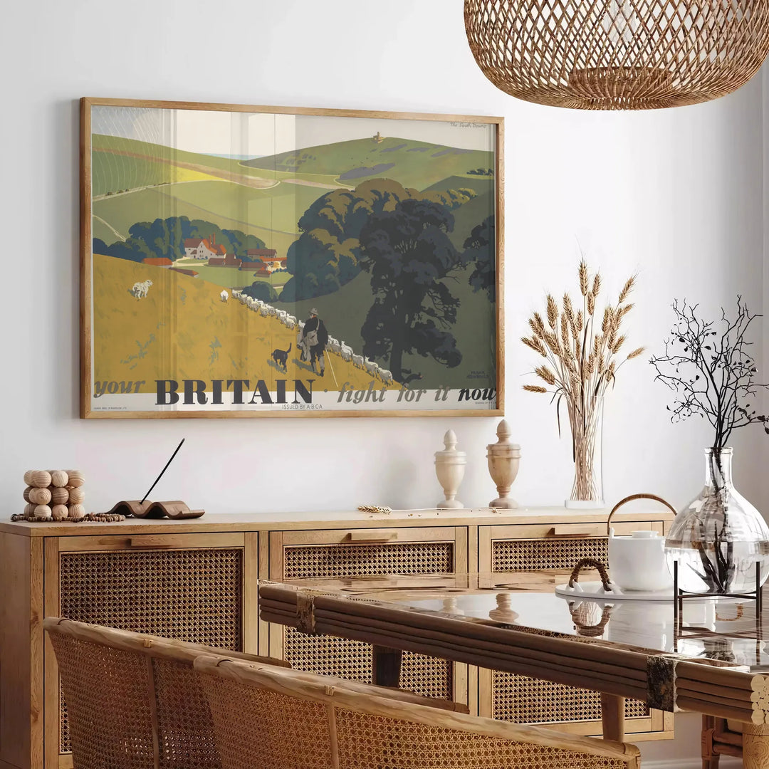 A vintage-style travel poster featuring iconic British landmarks in muted gray and green tones - in a Parisian living room with a sofa and a fig plant