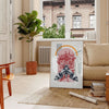 A black and orange butterfly illustration with intricate details - in a Parisian living room with a sofa and a fig plant