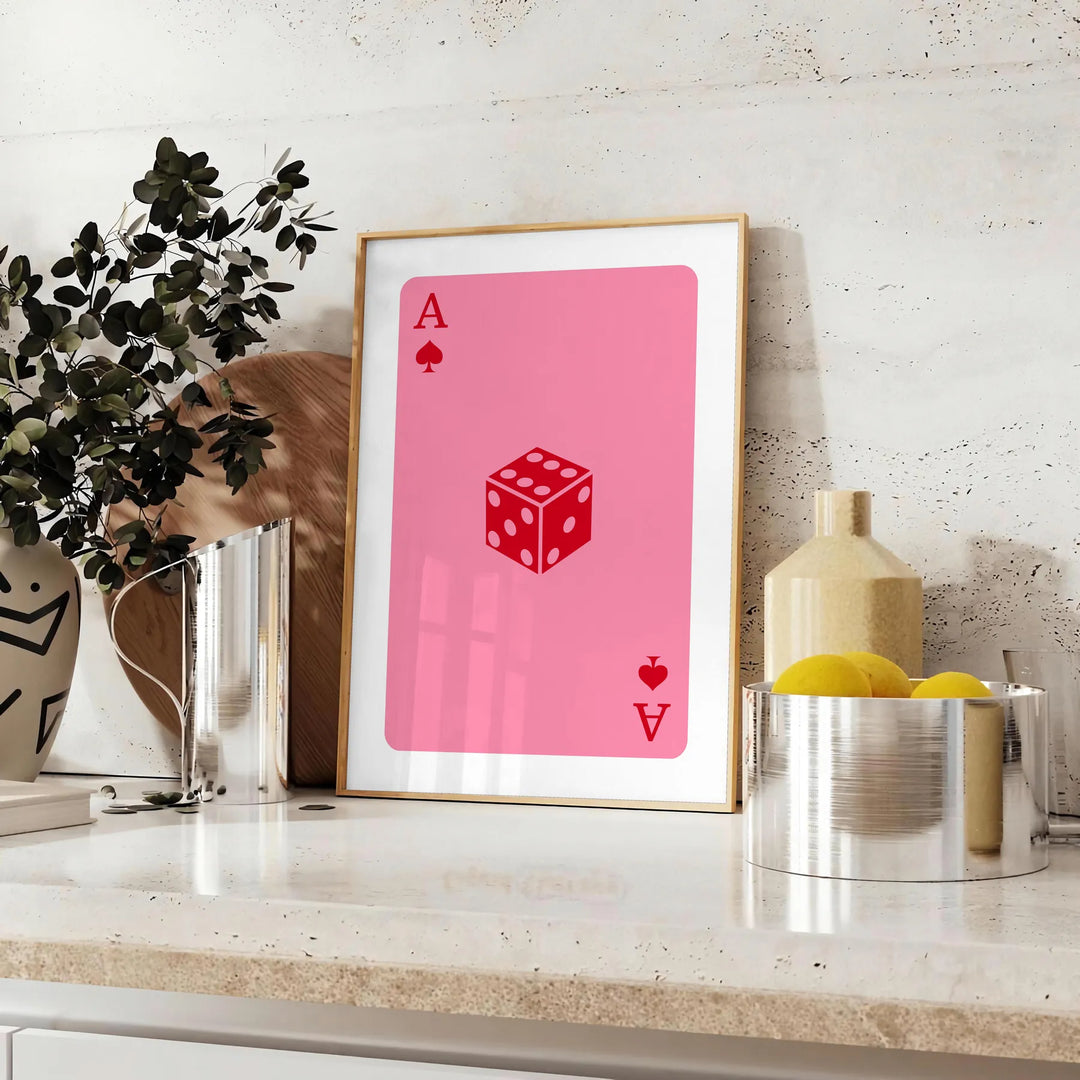 Colorful pop art style card design with bold orange and pink hues - styled on a counter with eucalyptus and a bowl of lemons