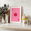 Colorful pop art style card design with bold orange and pink hues - styled on a counter with eucalyptus and a bowl of lemons