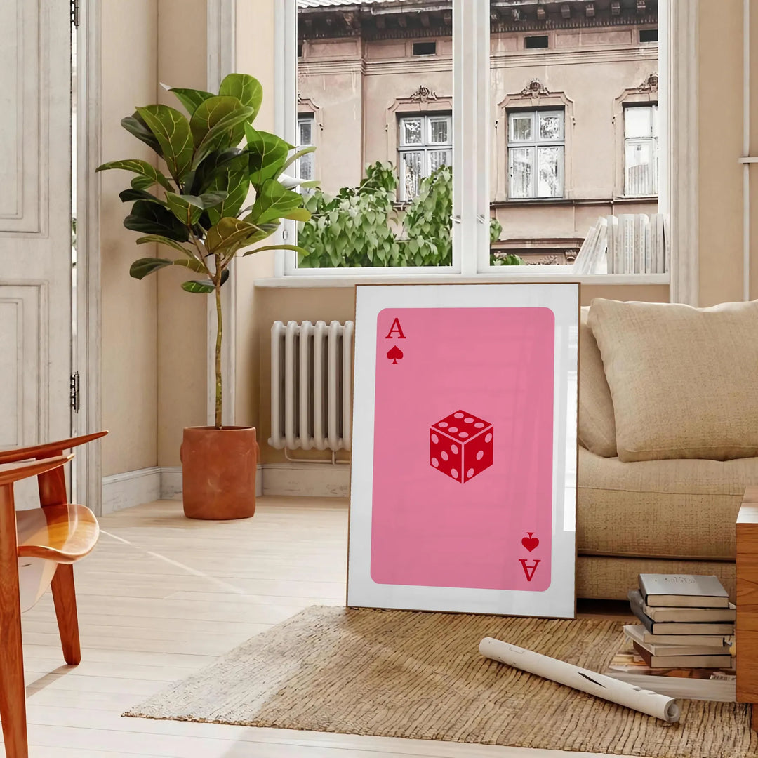 Colorful pop art style card design with bold orange and pink hues - in a Parisian living room with a sofa and a fig plant