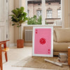 Colorful pop art style card design with bold orange and pink hues - in a Parisian living room with a sofa and a fig plant