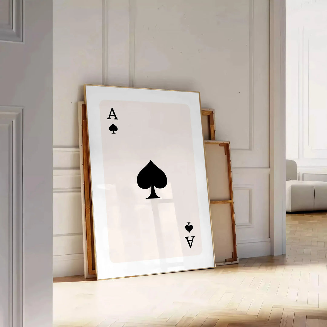A sleek gray and black poster featuring a modern card design with space elements - leaning on a herringbone floor against a white panelled wall