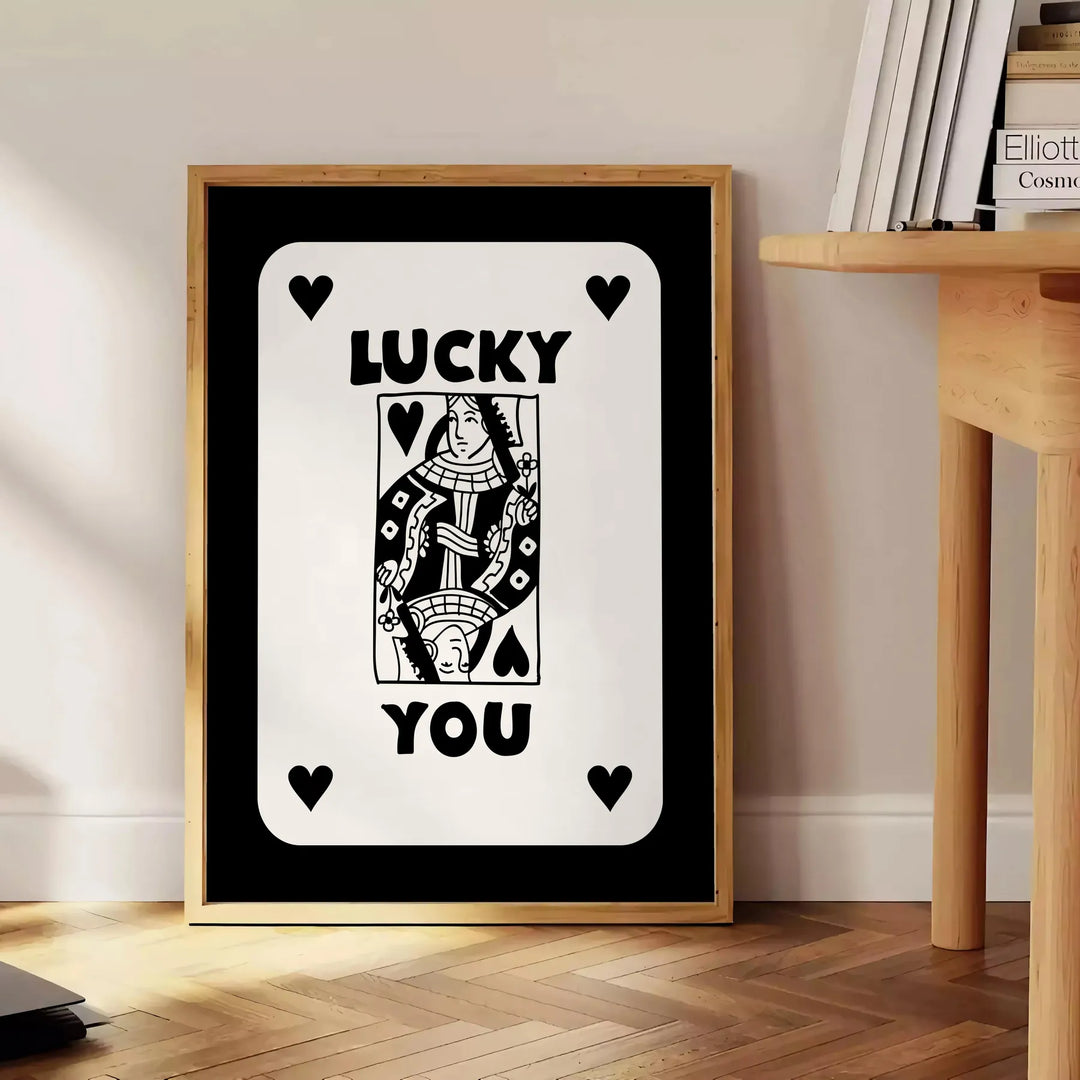 Abstract card design with sleek gray and black tones - beside a round wooden side table with books