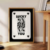 Abstract card design with sleek gray and black tones - beside a round wooden side table with books