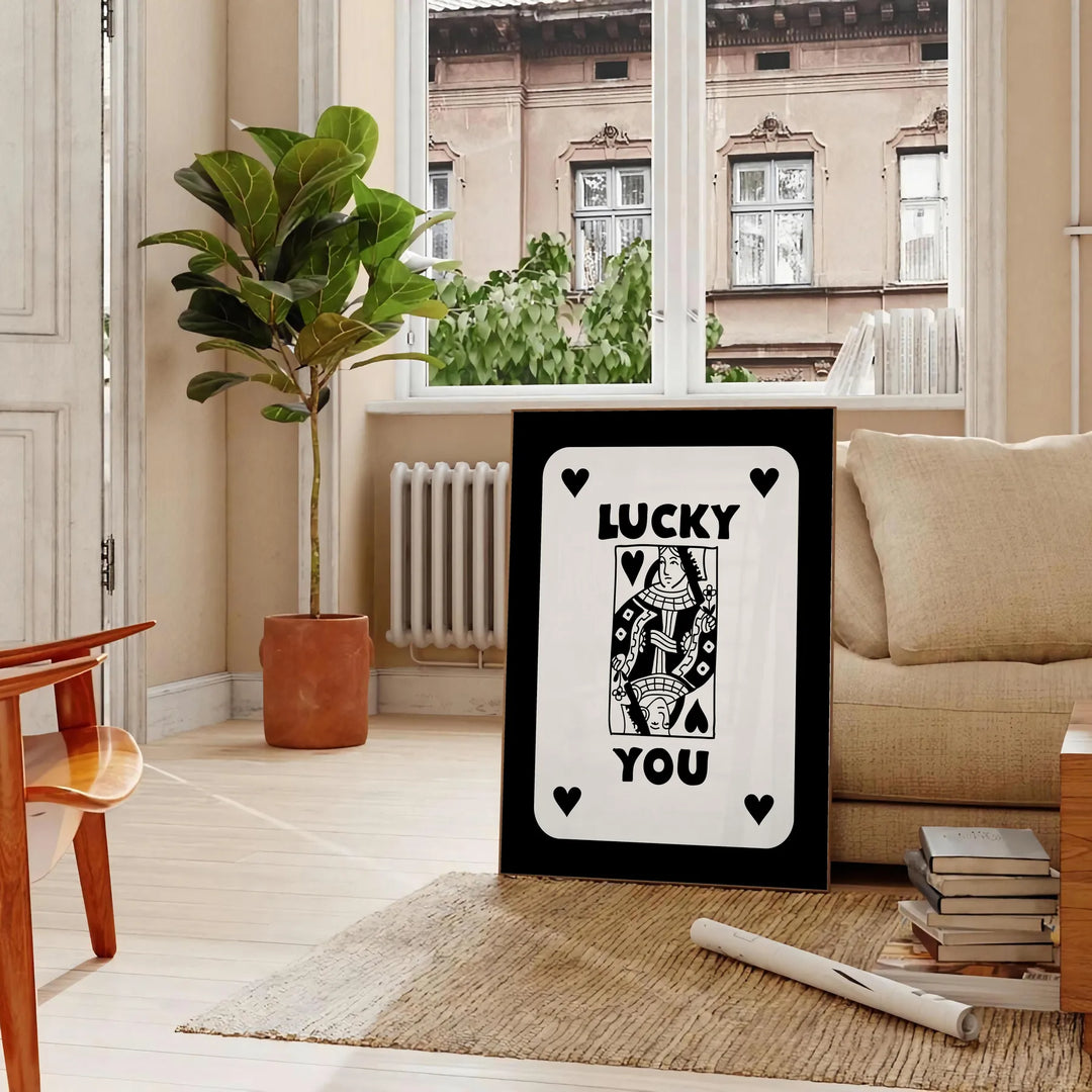 Abstract card design with sleek gray and black tones - in a Parisian living room with a sofa and a fig plant