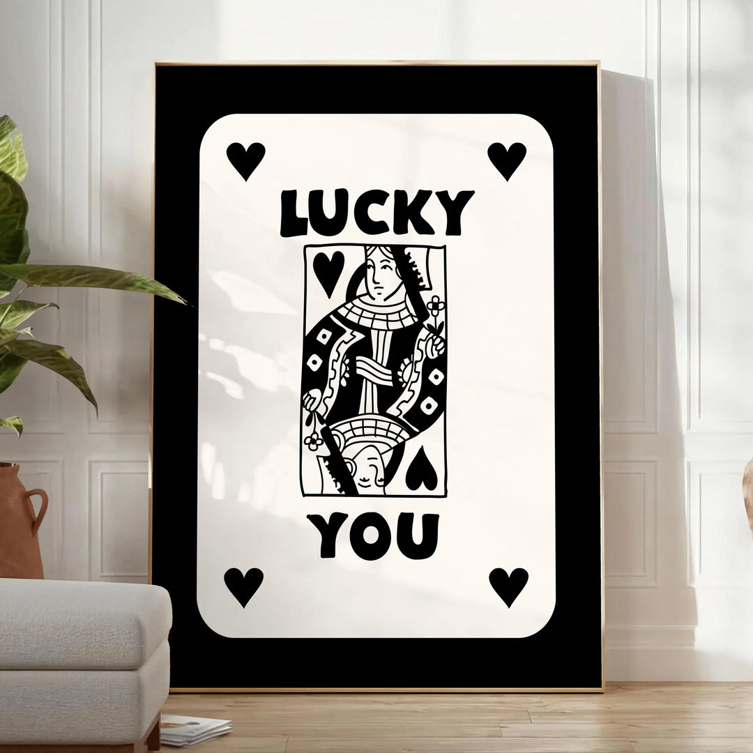 Abstract card design with sleek gray and black tones - in a bright minimalist room with a plant and an armchair