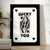 Abstract card design with sleek gray and black tones - in a bright minimalist room with a plant and an armchair