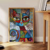 A playful cat illustration in gray and green tones - beside a round wooden side table with books