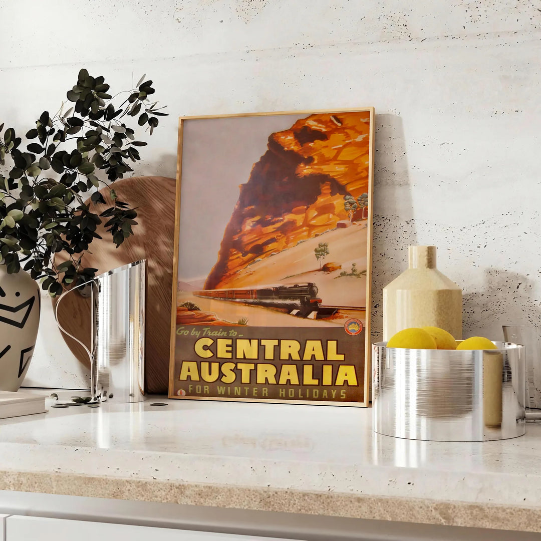Illustration of Central Australia with warm oranges and earthy tones - styled on a counter with eucalyptus and a bowl of lemons