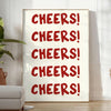 シンプルなデザインで「Cheers」の文字がグレーとホワイトで表現されています - 植物と肘掛け椅子のある明るいミニマルな部屋に