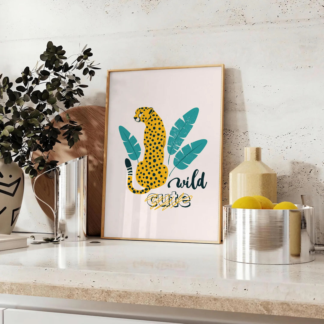 A cheetah in a dynamic pose with orange and blue tones - styled on a counter with eucalyptus and a bowl of lemons