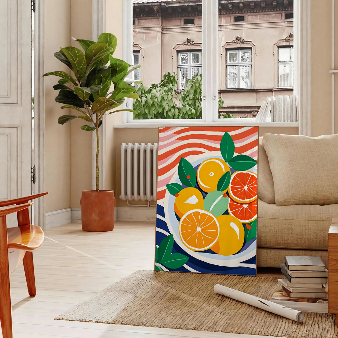 A kitchen scene featuring citrus fruits in bright orange and blue tones - in a Parisian living room with a sofa and a fig plant