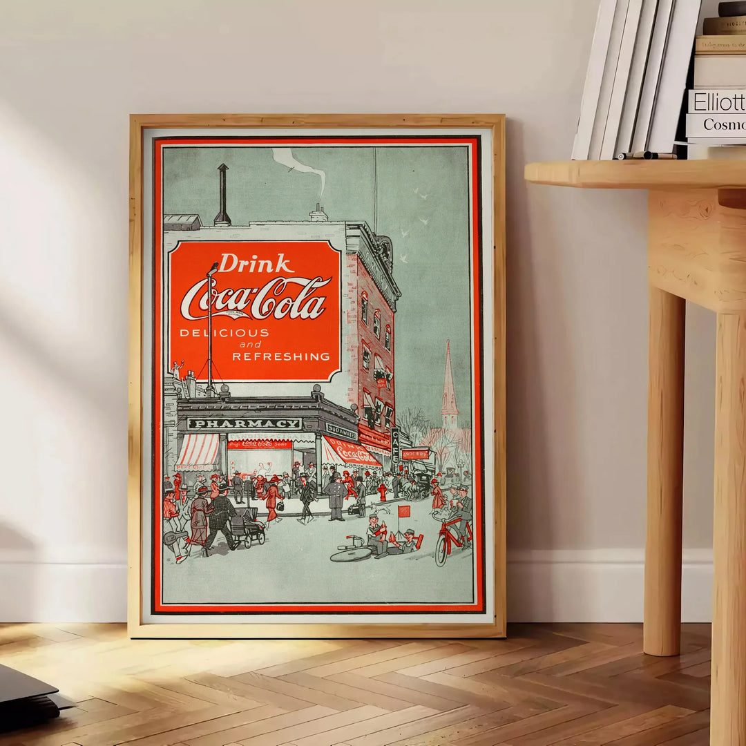 Retro plakat pubu Coca Cola w kolorze czarnym i zielonym - obok okrągłego drewnianego stolika z książkami