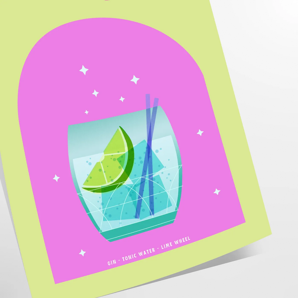 A gin and tonic cocktail in a glass with green and blue hues
