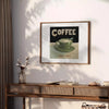 A kitchen scene featuring coffee cups and beans in green and orange tones - styled on a counter with eucalyptus and a bowl of lemons