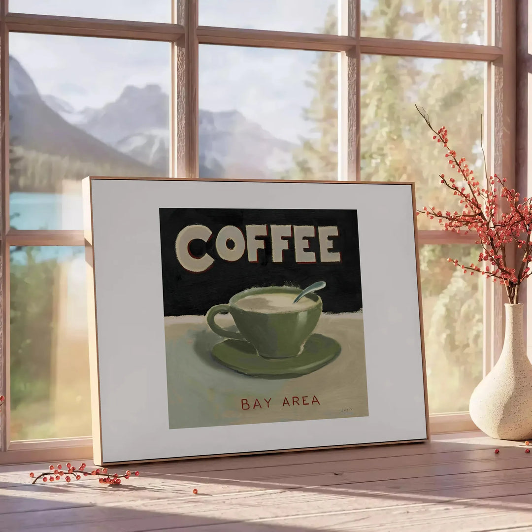 A kitchen scene featuring coffee cups and beans in green and orange tones - beside a round wooden side table with books