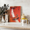 Communism Travel Poster featuring bold orange and brown colors in a vintage style - styled on a counter with eucalyptus and a bowl of lemons