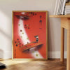 Communism Travel Poster featuring bold orange and brown colors in a vintage style - beside a round wooden side table with books