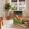 A vintage travel poster featuring communist themes in gray and brown tones - in a Parisian living room with a sofa and a fig plant