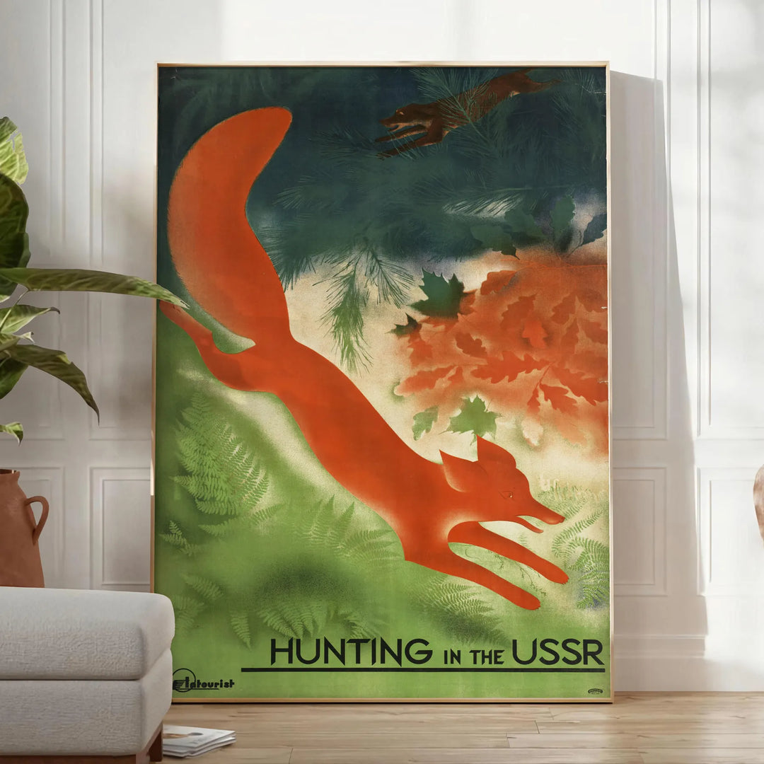 A vintage travel poster featuring communist themes in gray and brown tones - in a bright minimalist room with a plant and an armchair