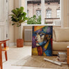 Cubist composition with geometric shapes in brown and green tones - in a Parisian living room with a sofa and a fig plant