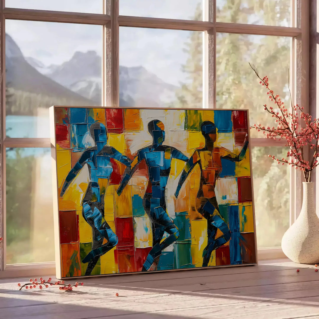 Abstract cubist composition with bold orange and blue shapes - beside a round wooden side table with books