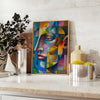 Cubist artwork featuring geometric shapes in green and blue tones - styled on a counter with eucalyptus and a bowl of lemons
