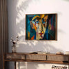 Cubist artwork featuring abstract shapes in green and blue tones - styled on a counter with eucalyptus and a bowl of lemons