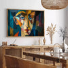 Cubist artwork featuring abstract shapes in green and blue tones - in a Parisian living room with a sofa and a fig plant