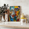 Cubist artwork featuring geometric shapes in green and gray tones - styled on a counter with eucalyptus and a bowl of lemons