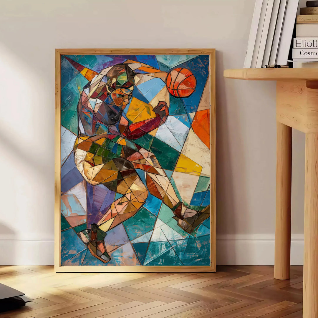 Cubist artwork featuring abstract shapes in shades of gray and green - beside a round wooden side table with books