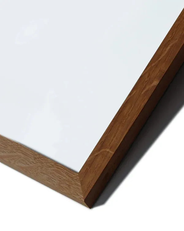 An oak frame surrounding a minimalist abstract design with earthy tones