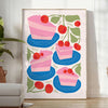 escena de cocina divertida con postres coloridos en tonos naranjas y azules - en una habitación luminosa y minimalista con planta y sillón