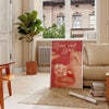 Abstract disco-themed artwork featuring brown and orange hues - in a Parisian living room with a sofa and a fig plant