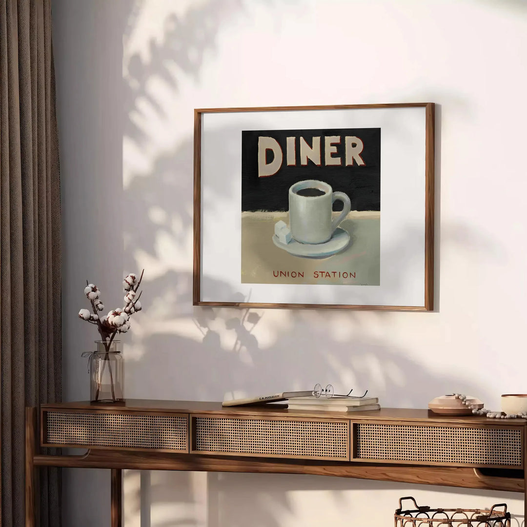A retro diner scene with black and orange colors, featuring a classic kitchen setup - styled on a counter with eucalyptus and a bowl of lemons