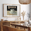 A retro diner scene with black and orange colors, featuring a classic kitchen setup - in a Parisian living room with a sofa and a fig plant