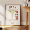 Illustration of a dirty martini cocktail in a glass, with olive garnish - beside a round wooden side table with books