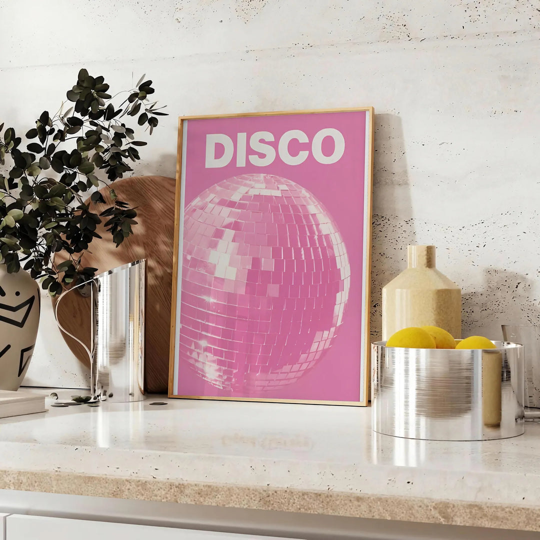 Abstract design featuring dynamic pink and orange shades reminiscent of disco themes - styled on a counter with eucalyptus and a bowl of lemons