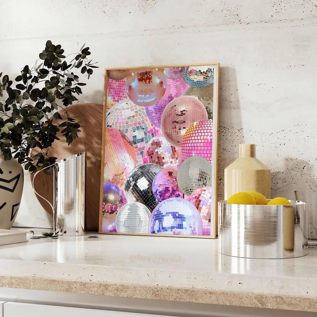 Abstract design featuring pink and purple hues with a disco theme - styled on a counter with eucalyptus and a bowl of lemons
