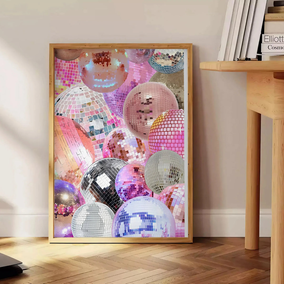 Abstract design featuring pink and purple hues with a disco theme - beside a round wooden side table with books
