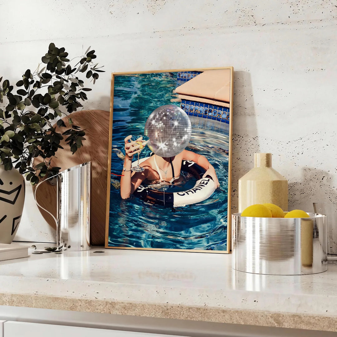 A retro-style illustration of a disco-themed swimming pool scene with brown and green tones - styled on a counter with eucalyptus and a bowl of lemons