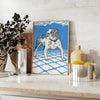 A dog floating in space with a starry background in blue and gray tones - styled on a counter with eucalyptus and a bowl of lemons