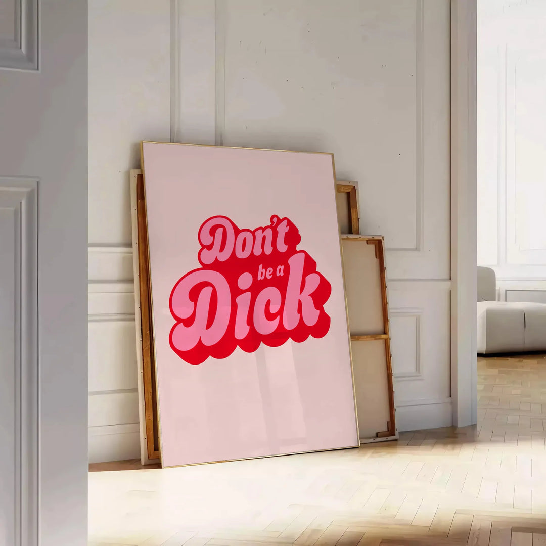 Colorful retro-style poster with the phrase 'Don't Be A Dick' in bold letters - leaning on a herringbone floor against a white panelled wall