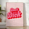 Colorful retro-style poster with the phrase 'Don't Be A Dick' in bold letters - in a bright minimalist room with a plant and an armchair
