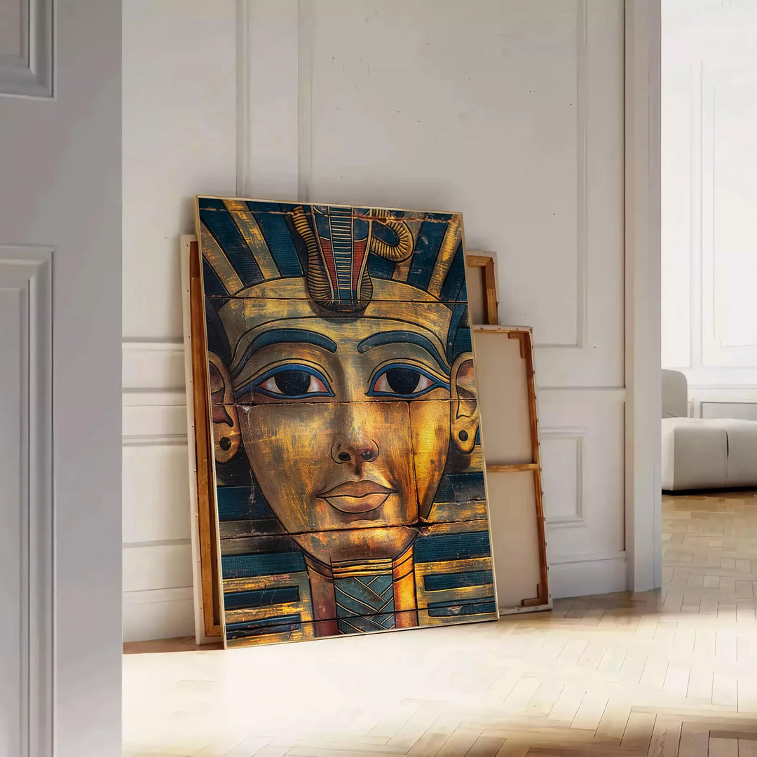 Ancient Egyptian artwork featuring hieroglyphics and symbols in green and orange tones - leaning on a herringbone floor against a white panelled wall
