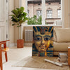 Ancient Egyptian artwork featuring hieroglyphics and symbols in green and orange tones - in a Parisian living room with a sofa and a fig plant