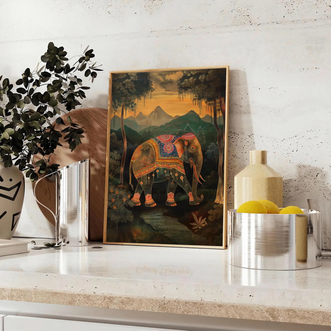 A colorful elephant illustration with green and orange hues. - styled on a counter with eucalyptus and a bowl of lemons